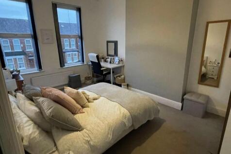 Bright, neatly presented master bedroom with a ...