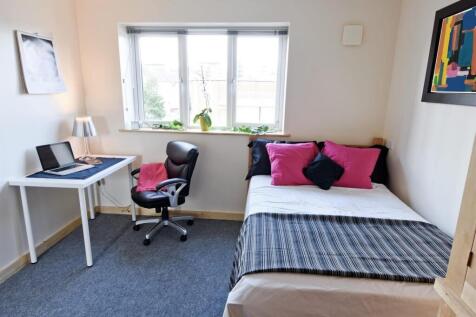 Bright bedroom with double bed and study area...