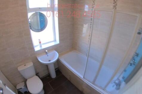 Bright, modern bathroom with a full bath and ov...