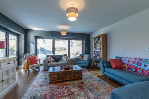 Sitting room with bi-fold doors to ga...