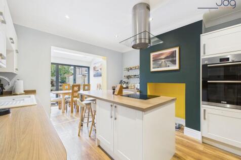 Open Plan Kitchen Diner with skylight and bi-fold doors