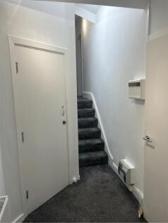 Bright, freshly painted hallway with new-lookin...