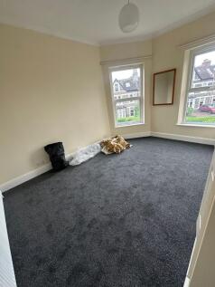 Spacious bright bedroom with large bay windows...