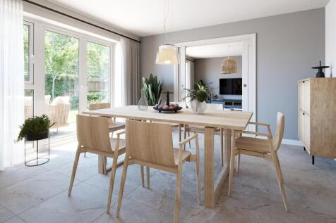 A bright and airy dining room with French doors to the rear garden