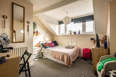 Bright and airy bedroom with large windows....