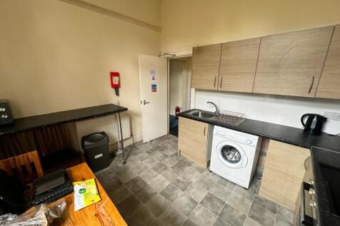 Bright fitted kitchen with laminate worktops, i...