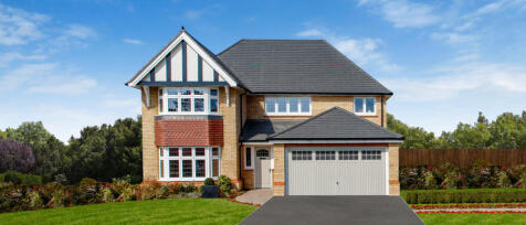 A modern two-storey detached house with a grey tiled roof, bay windows, a white garage door, and a w