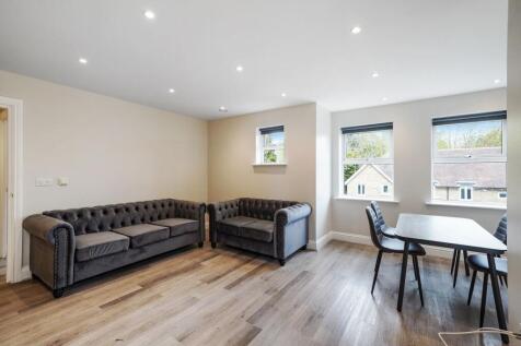 Bright lounge with plush sofas and dining area...