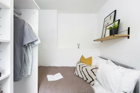 A cozy and inviting double bedroom with stylish...