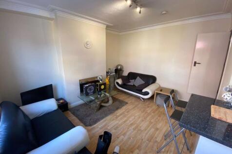 A spacious and well-maintained living room feat...