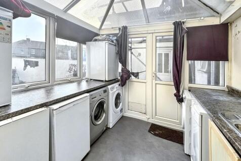 Bright utility area with laundry facilities...