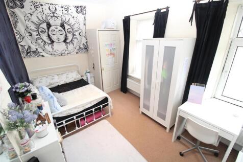 Bright bedroom with desk and stylish decor...