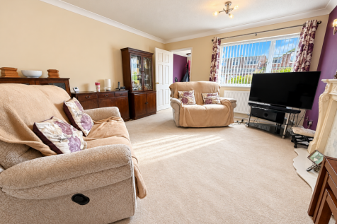 Cozy Plum-Accented Living Room.png