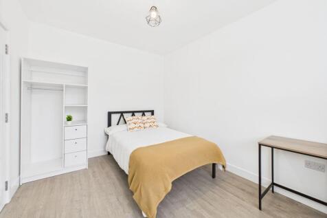 Bright and inviting master bedroom featuring a ...