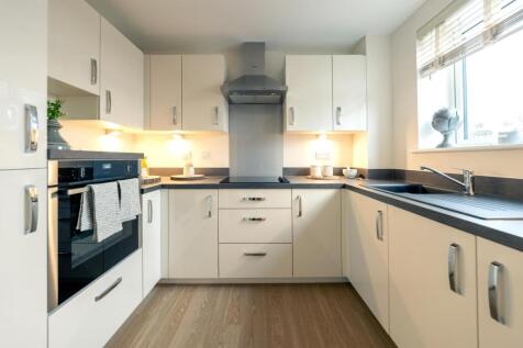 a kitchen with white cabinets