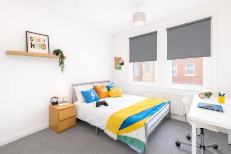 Bright, spacious bedroom with large study area...