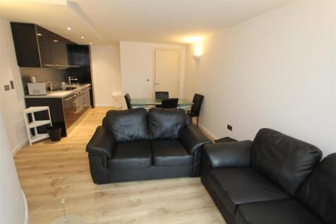 Spacious open-plan lounge with sleek furniture...