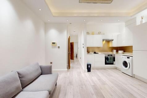 Modern open-plan lounge with fitted kitchen...