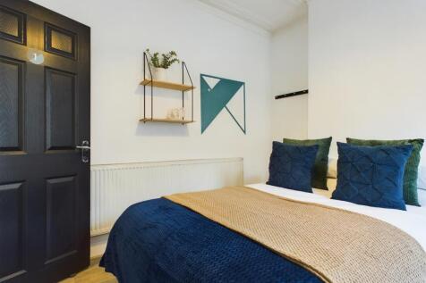 A stylish and inviting double bedroom featuring...