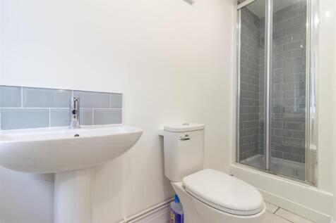 Modern bathroom with sleek grey tiling...