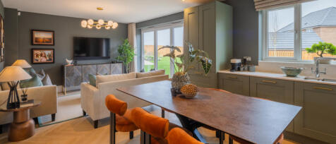 Redrow open plan kitchen dining family area with large double doors leading out to the garden