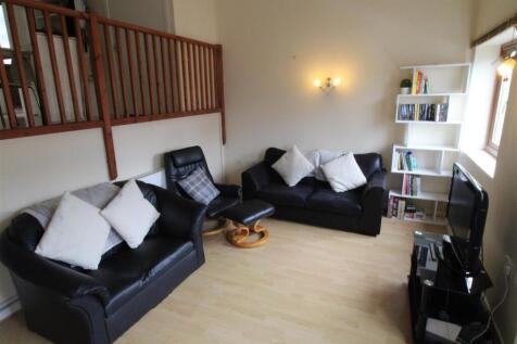 Spacious living area with comfy leather seating...