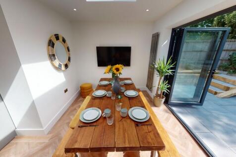 Bright and inviting living area featuring a lar...