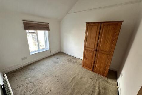 Bright bedroom with classic wood wardrobe...