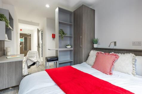 Bright modern bedroom with ample storage space...