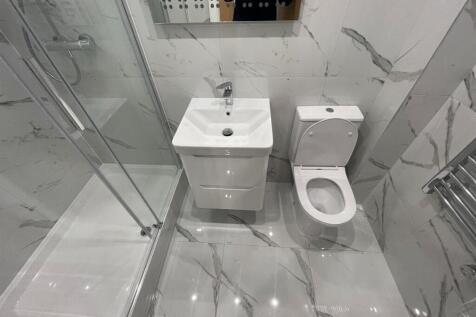 A clean and modern bathroom featuring a spaciou...