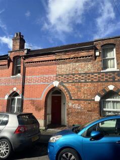 Charming red brick terrace under a clear blue s...