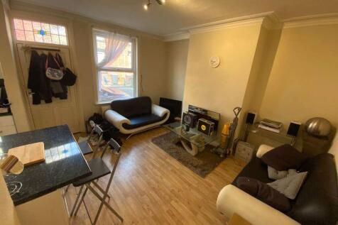 A bright and inviting living room featuring two...