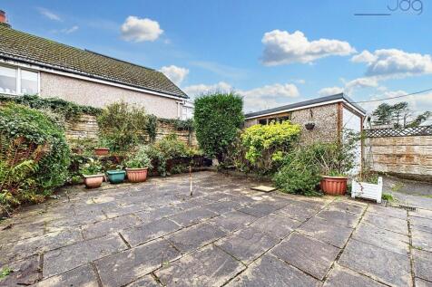 Rear Flagged Garden with Garage