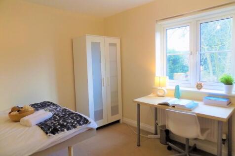 Bright and tidy single bedroom featuring a stud...