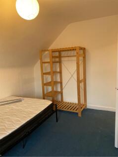 A spacious double bedroom featuring a minimalis...