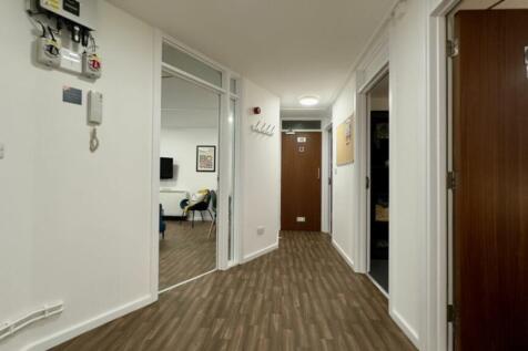 A well-maintained and spacious hallway with mod...