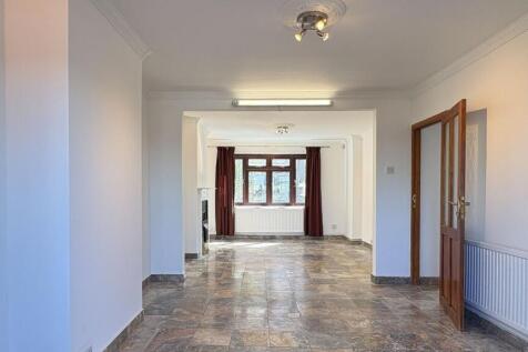 Bright expansive lounge with stylish tiled floo...