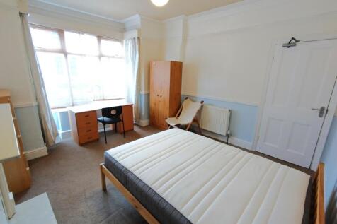 Bright master bedroom with a dedicated study ar...