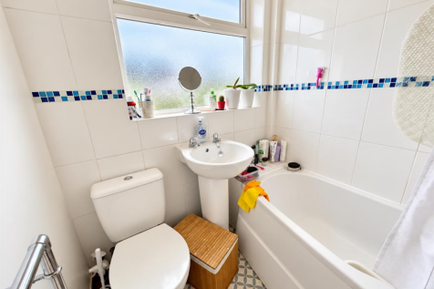 Bright Modern Bathroom with Blue Mosaic Tiles.png