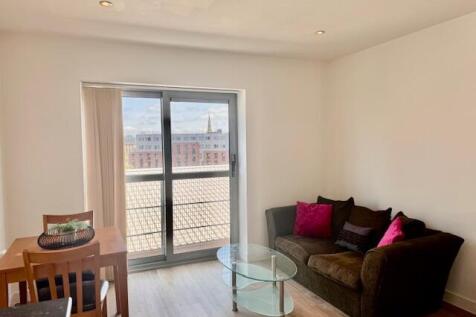 Bright living area with large window and view...