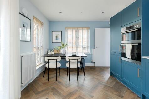 Dual aspect windows flood the dining space with light