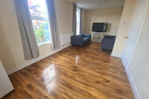 A spacious and well-maintained living room feat...