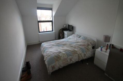 Cozy bedroom with double bed and window...