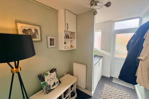 THROUGH ENTRANCE HALL WITH UTILITY AREA