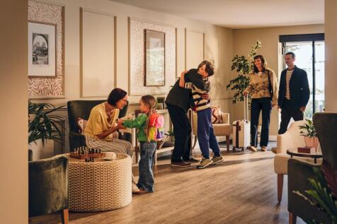 a group of people in a living room