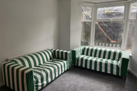Bright lounge area with stylish striped seating...