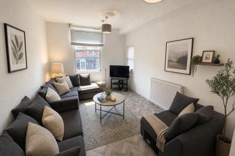 Bright living room with stylish corner sofa...