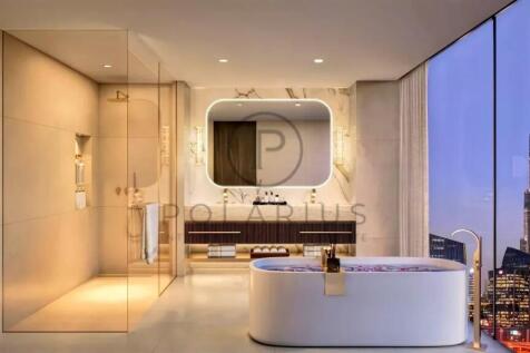 Luxurious bathroom with a bathtub, large mirror, a