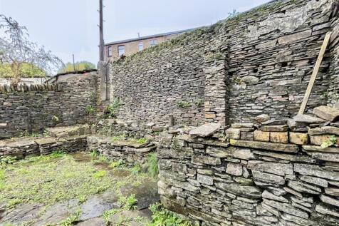 Private stone-walled courtyard space...