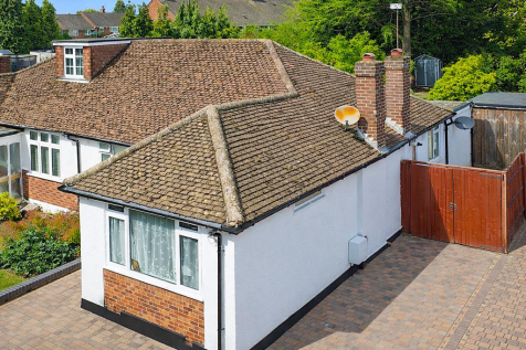 Suburban house with red brick accents.png